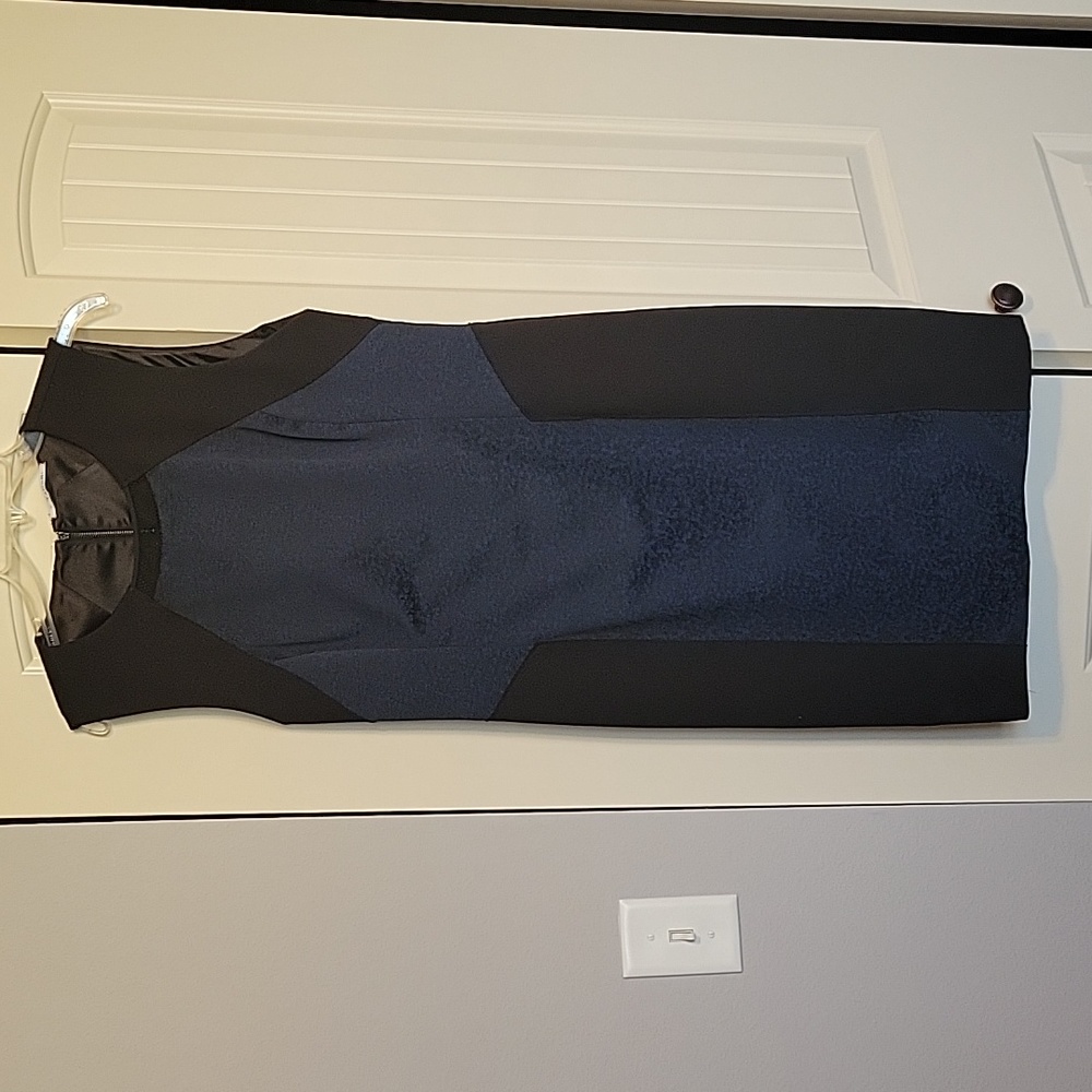 Black, dark blue form fitting mini dress.